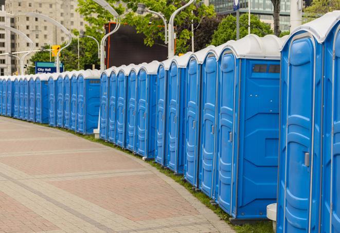 a fleet of portable restrooms ready for use at a large outdoor wedding or celebration in Atherton CA